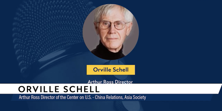 Orville Schell holding graphic